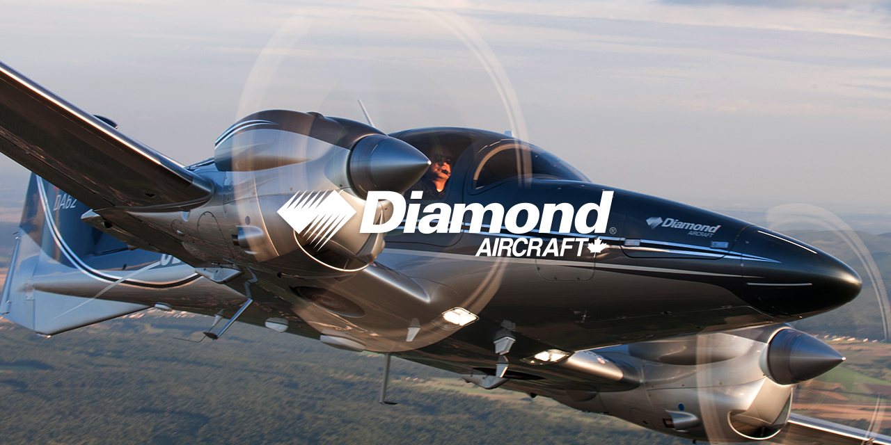 Diamond Aircrafts DA62 Airplane flying over fields